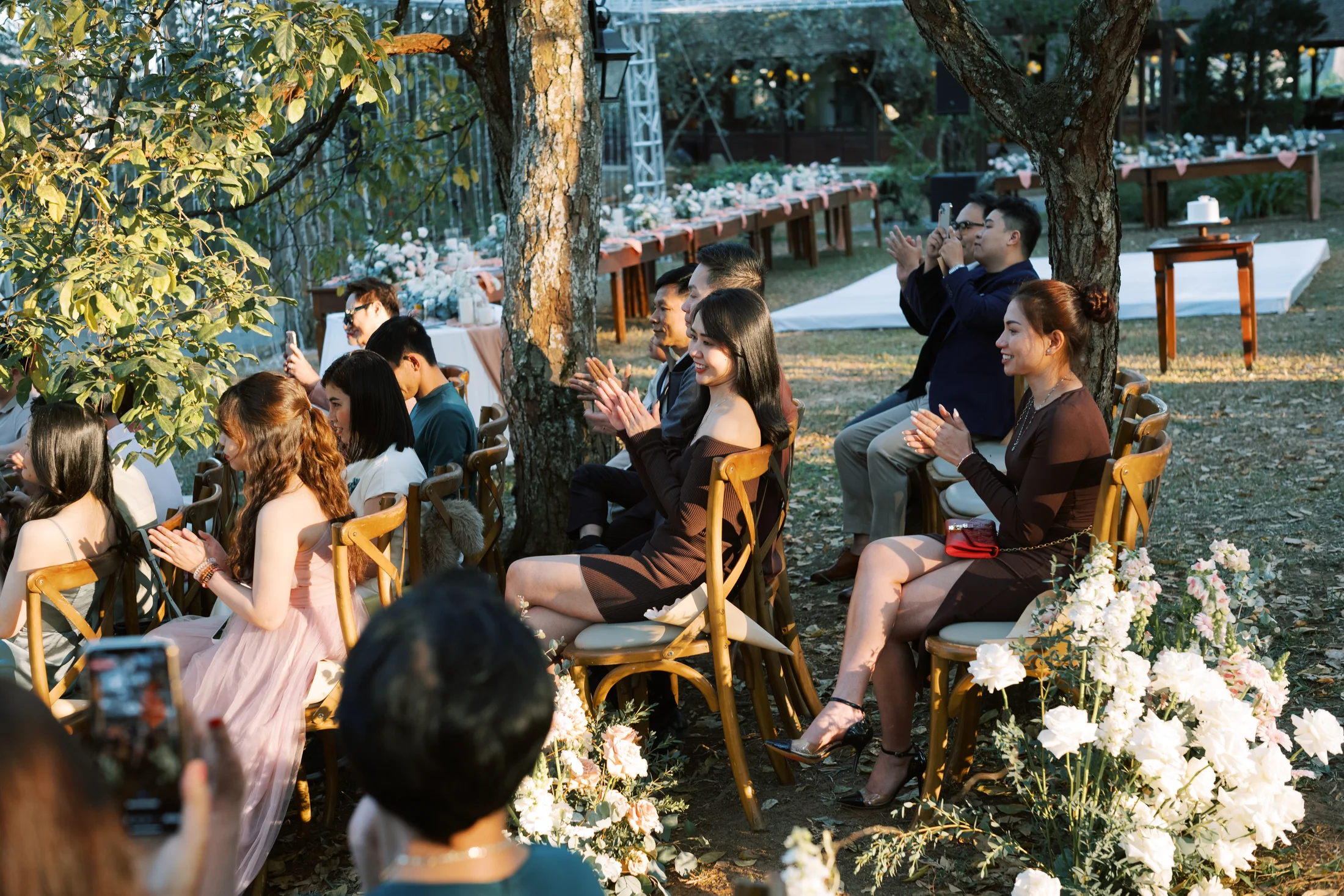 Guests gathered for an intimate outdoor wedding in Vietnam