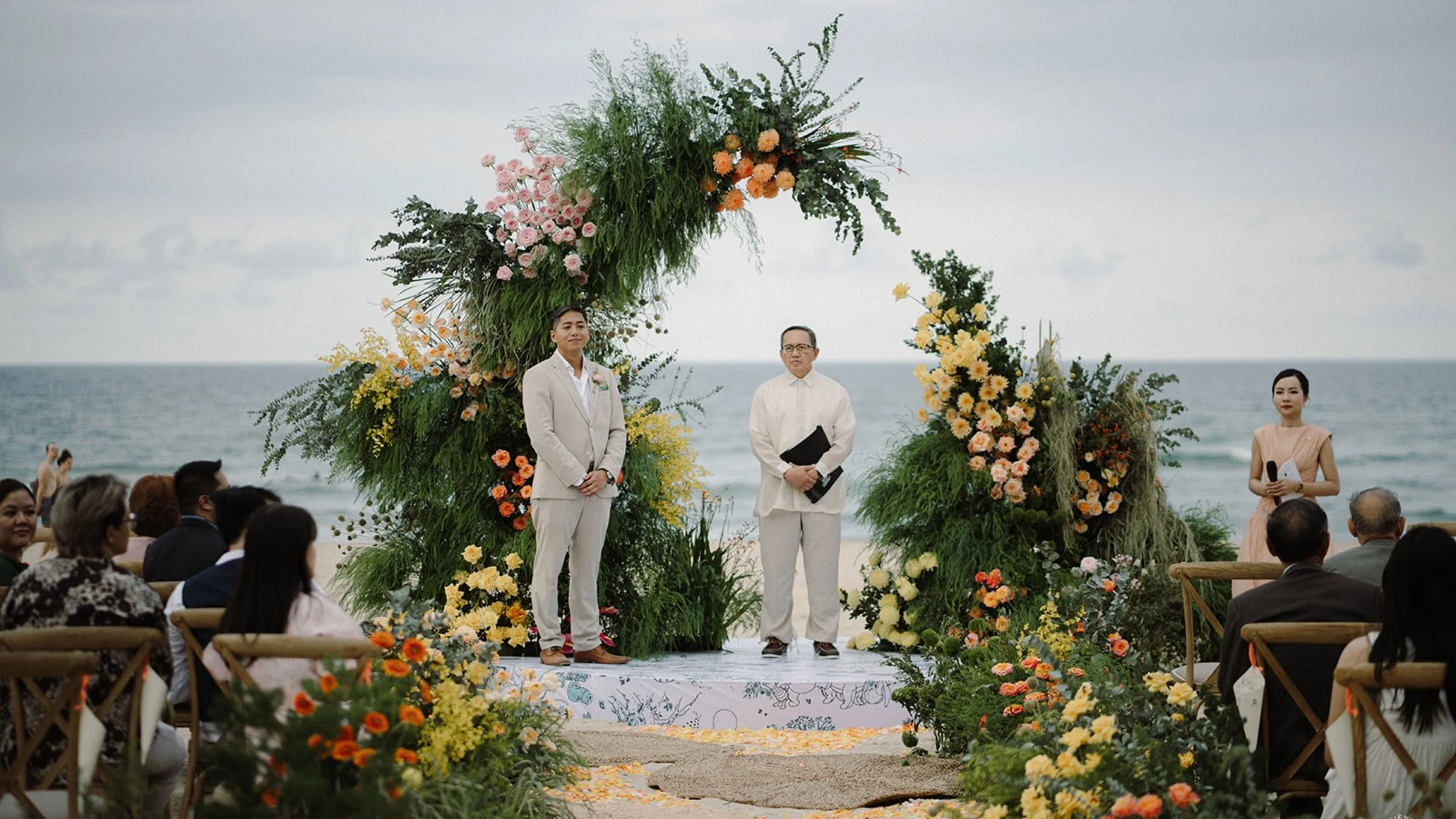 Coastal wedding ceremony with sculptural floral design in Vietnam