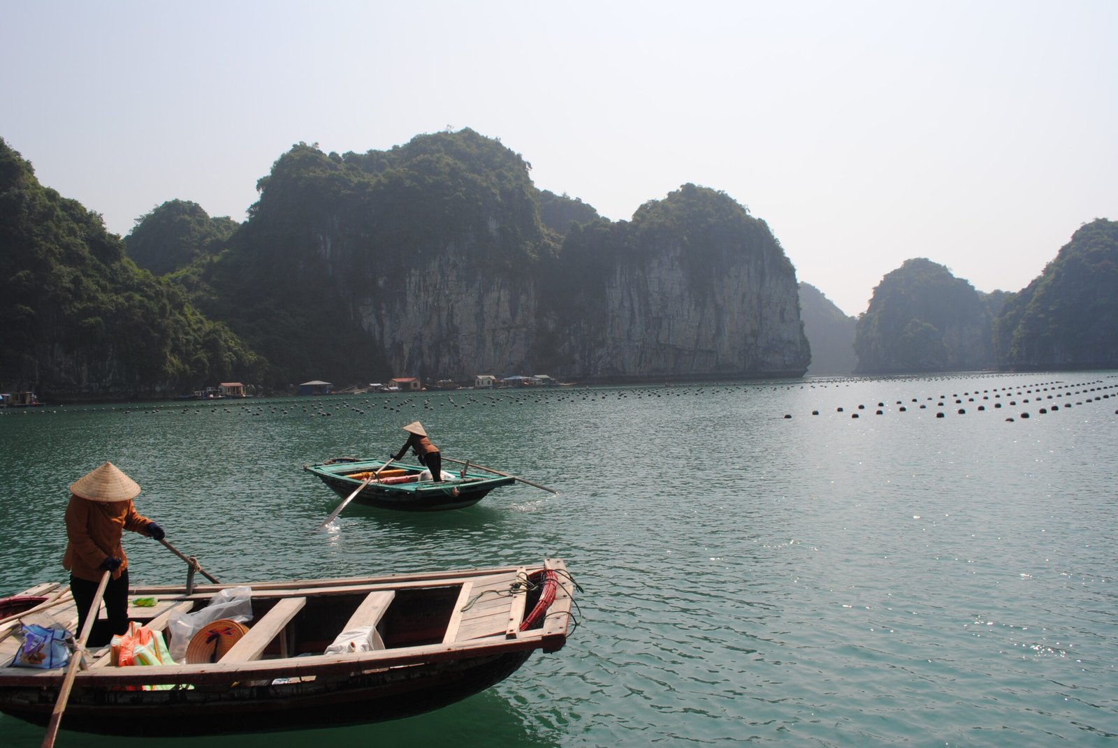 Traditional boats among limestone islands in Ha Long Bay Vietnam